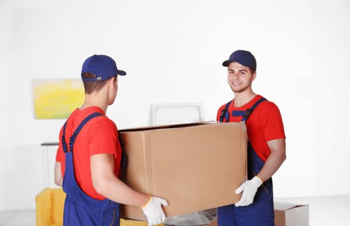 Professional packers preparing boxes in Finchley